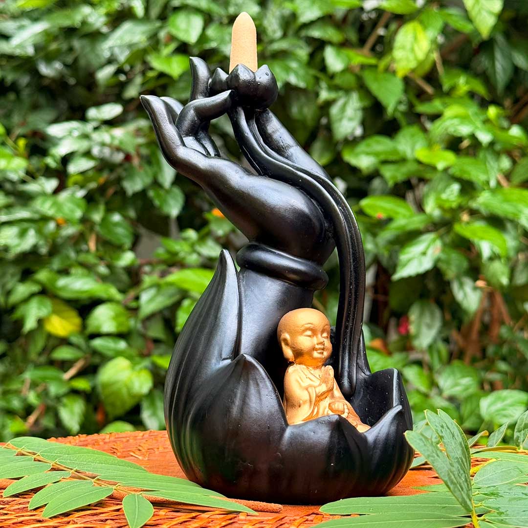 Incensário Mudra da Iluminação Buda Pelicano Azul, com cone de incenso acoplado e uma pequena estátua de Buda na base.