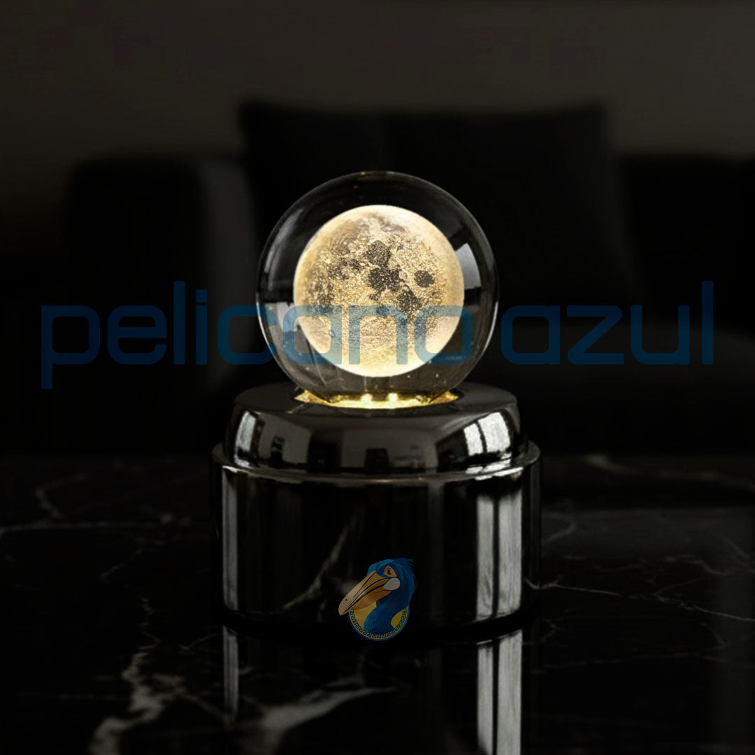 luminária giratória com lua cheia detalhada sobre base metálica preta iluminada