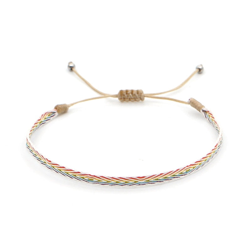 Bracelete ajustável de fio colorido com padrão trançado, parte do Conjunto Budista da Amizade, com estilo minimalista e espiritual, Pelicano Azul.
