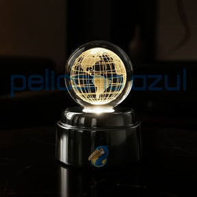 luminária giratória com globo terrestre iluminado sobre base metálica elegante